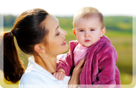 A childcare staff and a baby