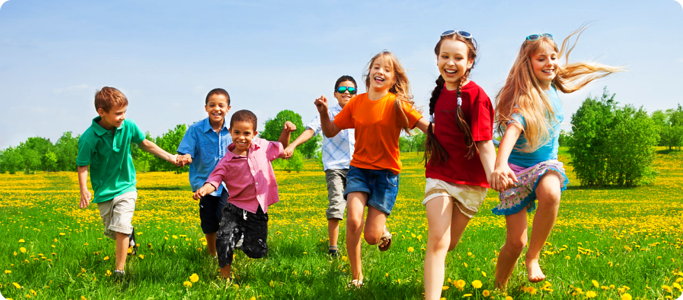 Children running in a flower field